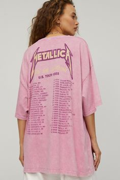 a woman wearing a pink metallic jacket with the band's dates printed on it