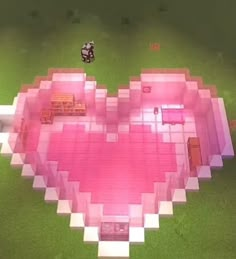 a heart shaped object in the middle of a field