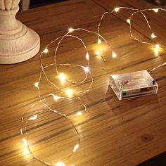 a table with some lights on it and an ebay card in front of it