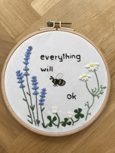 a cross stitch project with the words, everything will be ok and a bee on it