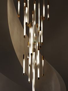 a modern chandelier hanging from the ceiling