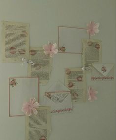 several pieces of paper with pink flowers on them