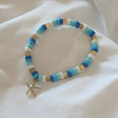 Ocean Theme Clay Beaded Bracelet - stretchy - handmade Ocean Themed Arts And Crafts, Beach Themed Clay Bracelet, Vacation Clay Bead Bracelets, Cute Clay Bead Designs, Blue Summer Bracelets, Ocean Themed Clay Bead Bracelets, Starfish Clay Bead Bracelet, Cute Clay Bead Bracelet Ideas Beach, Neutral Clay Bracelets