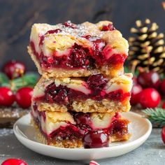 cranberry cheesecake bars stacked on top of each other