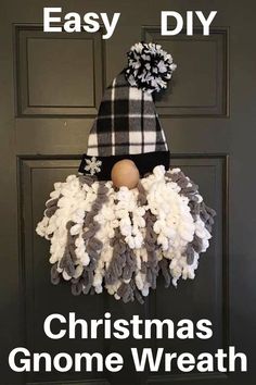 a black and white wreath with a plaid hat on it