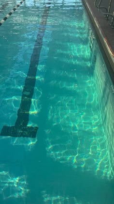 an empty swimming pool with clear blue water