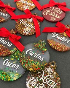 christmas ornament ornaments with red bows and glitters on the bottom one is personalized