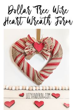 a heart wreath hanging on the wall with hearts around it and text overlay that reads dollar tree wire heart wreath form