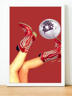 a red poster with a disco ball and legs