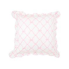 a pink and white pillow on a white background