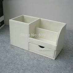 a white desk organizer with two drawers