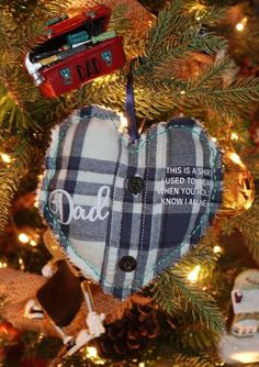 a heart ornament hanging from a christmas tree