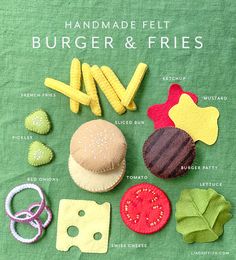 the hamburger and fries are made out of felt, scissors, and other things to make them look like food