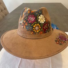 This Mexican Suede Hat Has Beautiful Hand Painted Flowers, Perfect To Add That Special Touch To Any Outfit. This Mexican Hat Is Completely Unique And One Of A Kind! Hand Painted Material: Suede, Hand Painted Made In Mexico Size Large Final Sale - No Returns Multicolor Casual Fedora For Spring, Casual Multicolor Fedora For Spring, Casual Multicolor Hat Bands For Spring, Beige Fedora For Spring Festival, Bohemian Felt Hat For Beach In Spring, Bohemian Felt Hat For Beach Spring, Adjustable Multicolor Spring Fedora, Spring Multicolor Adjustable Fedora, Spring Bohemian Felt Hat For The Beach