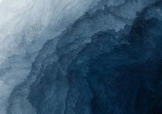 the inside of an ice cave with blue water