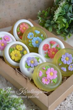 six soaps in a box with flowers painted on them