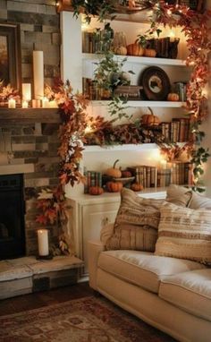 a living room filled with furniture and a fire place next to a mantle covered in candles