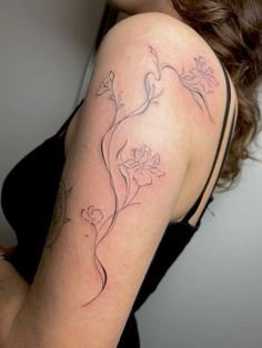 a woman with a tattoo on her arm