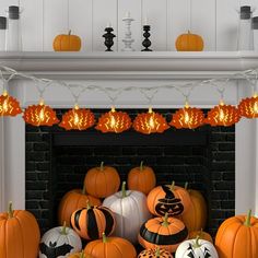 a fireplace decorated for halloween with pumpkins and jack - o'- lantern lights