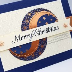 a close up of a christmas card with a crescent and star design on it,