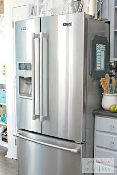 a large stainless steel refrigerator in a kitchen