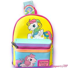 My Little Pony Has A Colorful Artwork Covers All Sides Of This Handy Backpack In Bold Blocks Of Yellow, Pink, Seafoam Green, Purple, And Blue. Fan-Favorite My Little Pony Characters Come To Life In Playful Prints. You Might Spot Starshine, Peachy, Applejack, Glory, Skydancer, Blossom, And Snuzzle. Pack Just What You Need For The Day To Take The Reins In Style. Features: Vegan Leather (Polyurethane) Padded, Adjustable Shoulder Straps Zippered Front Pocket For Securing Smaller Items Side Pockets S Cute Yellow Backpack For Back To School, Playful Yellow Bags For Back To School, Cute Yellow Backpack Bag, Playful Yellow Backpack For Back To School, Fun Yellow Backpack Bag, Fun Yellow Backpack, Cute Yellow Travel Backpack, Yellow Softback Bags For School, Yellow Shoulder Backpack For School