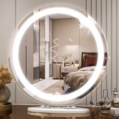 a round mirror sitting on top of a table