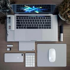 an open laptop computer sitting on top of a desk next to a mouse and keyboard