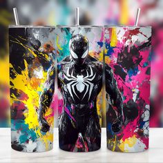 two tumblers with the image of a spider - man painted on one side and the other