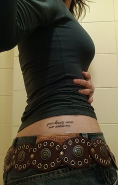 a woman with a tattoo on her stomach