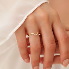 Your V Shaped Stacking Ring is stylish, dainty and pretty ideal for everyday use. Details of solid gold handmade Curved Diamond Ring are very eye-catching. It is a great gift for your loved ones. This jewelry will be an indispensable piece of yours. This meaningful Matching Wedding Band with high quality handwork will be a legacy you can leave to your family its.  * Cz Diamond Chevron Ring Details * Material / Gold Kt:  14K (585), 18K (750), 8K (333) * Available Gold Colors: Yellow Gold, White G Dainty Diamond Ring With Vs Clarity And Open Band, Dainty Vs Clarity Diamond Ring With Open Band, Dainty Open Ring With Simple Design For Wedding, Simple Open Band Midi Rings For Weddings, Simple Toe Rings For Weddings, Simple Adjustable Diamond Wedding Ring, Adjustable Initial Ring With Simple Design For Wedding, Dainty Crystal Ring With Simple Design For Wedding, Simple Open Ring Diamond Wedding Ring