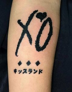 a tattoo with the word xo written in japanese characters on it's arm