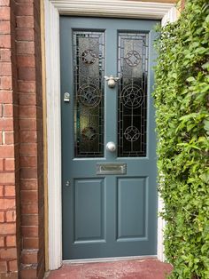 a blue door with stained glass on it