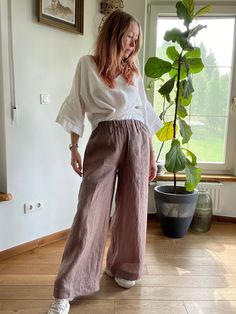 This super comfy loose fitting elasticated pants are made of softened European 100% linen.  They are great for a casual style all day long summer days.  Very classic and practical summer colour. It has got 2 pockets on the sides. It is the ultimate fabric for hot weather as it breathes and absorbs moisture better that any fabric on earth. Please write me a note if you would like any other colour from our fabric options, using a number or a name of a colour of your choice. Please write if you nee Neutral Wide Leg Pants For Beach, Relaxed Linen Wide Leg Trousers, Relaxed Linen Wide Leg Summer Pants, Baggy Linen Bottoms For Vacation, Baggy Beige Linen Harem Pants, Beige Baggy Linen Harem Pants, Casual Brown Linen Wide Leg Pants, Relaxed Fit Ramie Pants For Summer, Summer Relaxed Fit Ramie Pants