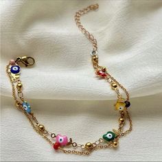 2 Bracelets In 1 For A Layered Look One Gold Plated Chain Link Bracelet & 1 Multi Candy Colored Camel Charm Bracelet Green, Red, Yellow, Purple, Blue, Green And Pink Colored Evil Eye With Gold Camel Charm Detailing Clasp Closure So Gorgeous & Chic Most Beautiful Gift Around 8.66 Inch & 2.36 Inch Extended Chain New. Perfect Condition Valentine’s Day Love Gift Colorful Rainbow Multicolor Copper Trendy Gorjana White Gold Silver Metallic 14k Adinas Jewels Swarovski Yellow Gold Black Pupil Diamond Ac White Metal Anklet Perfect For Gifting, White Metal Anklets For Gift, White Metal Anklet As Gift, Adjustable Delicate Chain Bracelets For Summer, Adjustable Delicate Chain Bracelet For Summer, Adjustable Chain Bracelets For Summer, Handmade Trendy Gold Anklets, Trendy Handmade Gold Anklets, Multicolor Metal Chain Bracelet