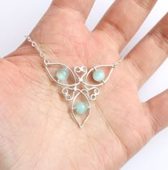 "Celtic triquetra knot necklace is handcrafted from silver-filled wire* and 3 gorgeous cat's eye glass stones in your CHOICE of color (see last photo for options). Model pieces shown in \"Kelly\" and \"Seafoam.\" Choker style necklace has a sterling silver spring ring clasp and adjustable cable chain for a length of 16-18 inches. Please see third photo for measurements. Necklace will ship gift-boxed, perfectly ready to treat yourself or a special someone! Please note that due to the creation pro Triquetra Necklace, Celtic Triquetra, Celtic Knot Jewelry, Irish Spring, Wire Wrapped Stone Jewelry, Wire Jewelery, Wire Wrap Jewelry Designs, Wire Wrapped Jewelry Diy, Wire Jewelry Designs