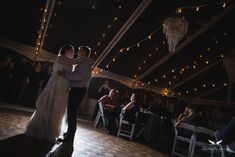 a bride and groom sharing their first dance