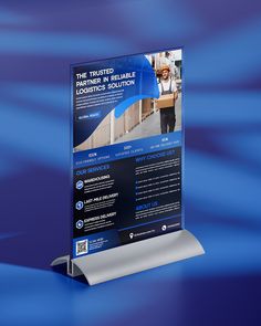 a roll up banner stands on a blue background with an image of a man carrying boxes