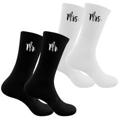 three pairs of black and white socks with mr and mrs written on the bottom one