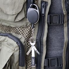 a pair of scissors sitting on top of a backpack