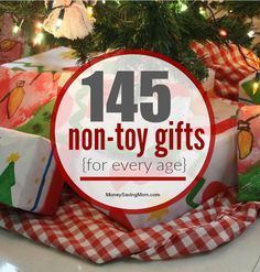 presents under the christmas tree with text overlay that reads,'45 non - toy gifts for every age '