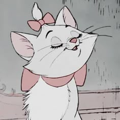 an animated image of a cat with a bow on its head