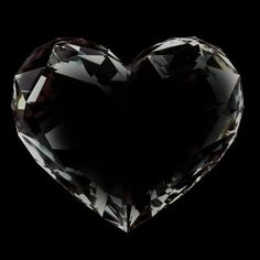 a heart shaped diamond on a black background