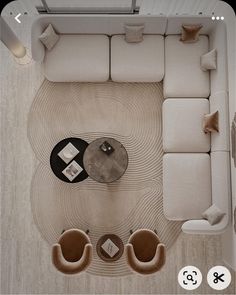 an aerial view of a living room with couches and tables