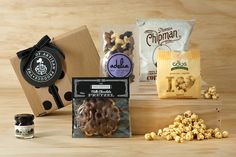 an assortment of snacks including popcorn, nuts and cheese