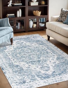 a blue and white rug in a living room