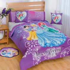 a bed with purple sheets and disney princess bedspreads on top of wooden flooring