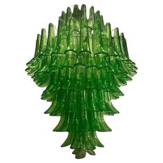 a green glass chandelier hanging from the ceiling