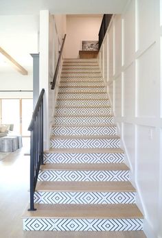 the stairs are decorated with white and blue carpet