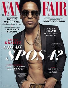 a shirtless man wearing sunglasses on the cover of vanity fair magazine, with his hands in his pockets